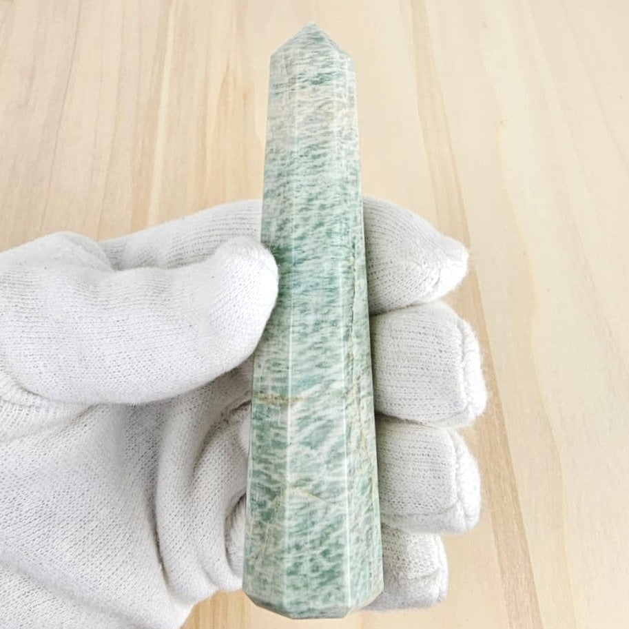 amazonite tower in gloved hand