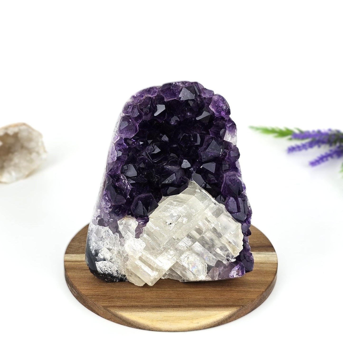 amethyst cluster a grade on a wooden plate and white background