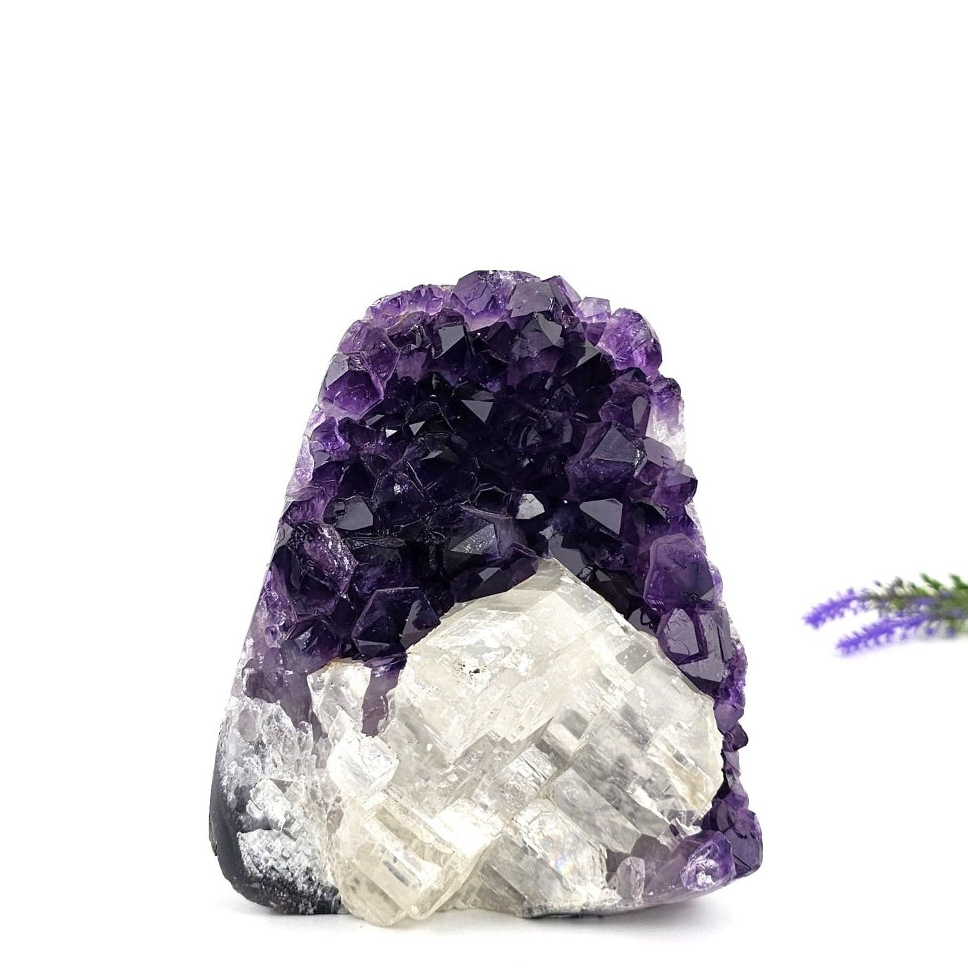 Amethyst crystal formation on a white background
