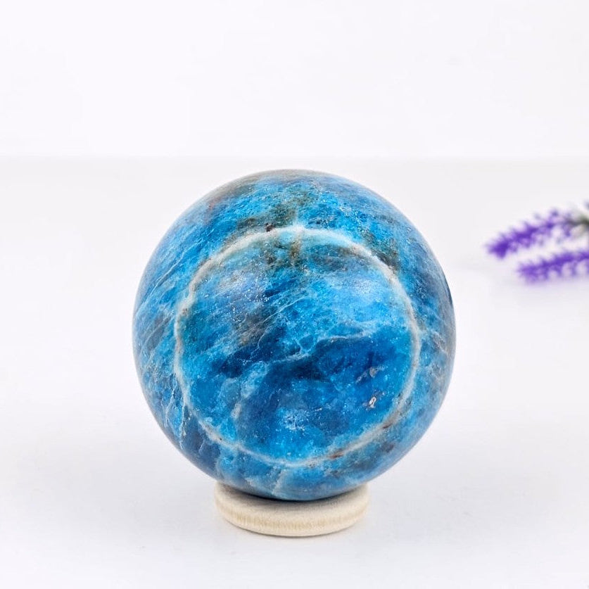Blue apatite sphere on a white background