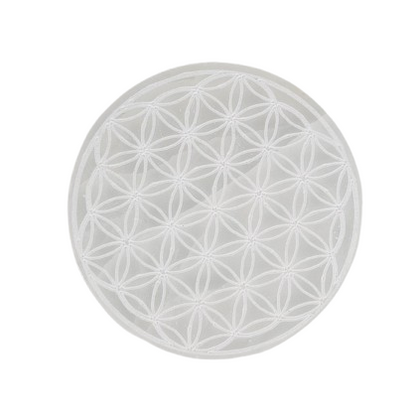 Round white charging disc with a floral pattern on a white background