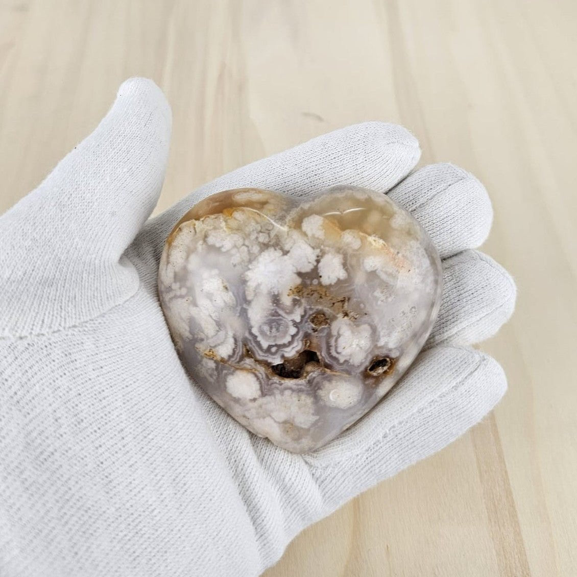 Flower agate in gloved  hand