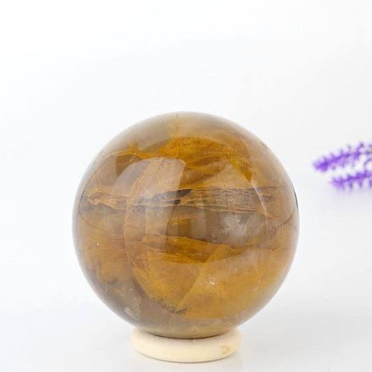 golden healer crystal sphere on a white background