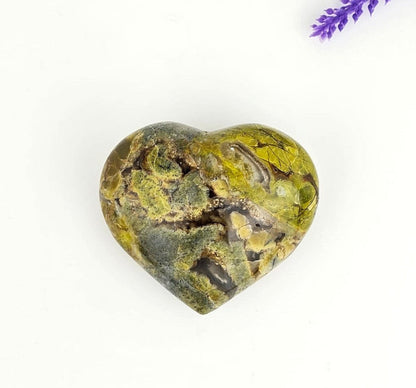 Green opal heart on a white background