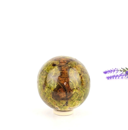 Green opale sphere on a white background