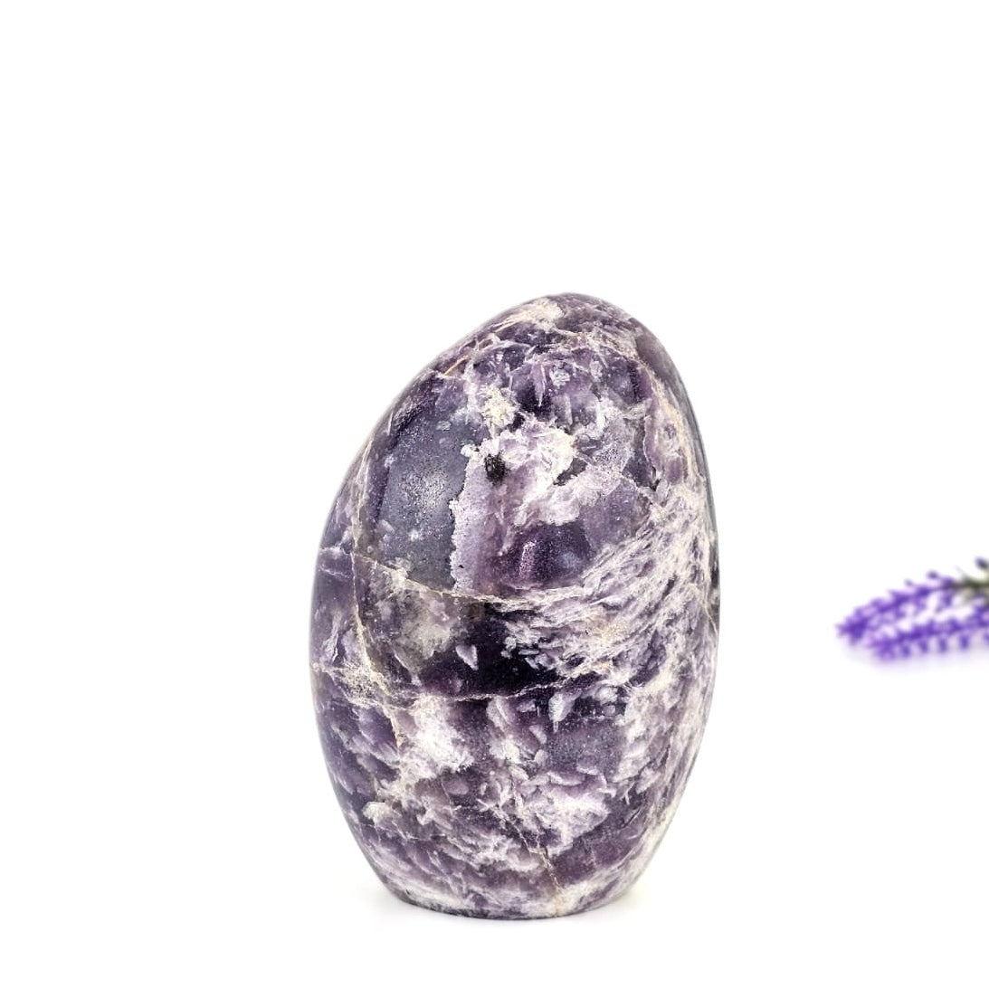 Lepidolite crystal on a white background