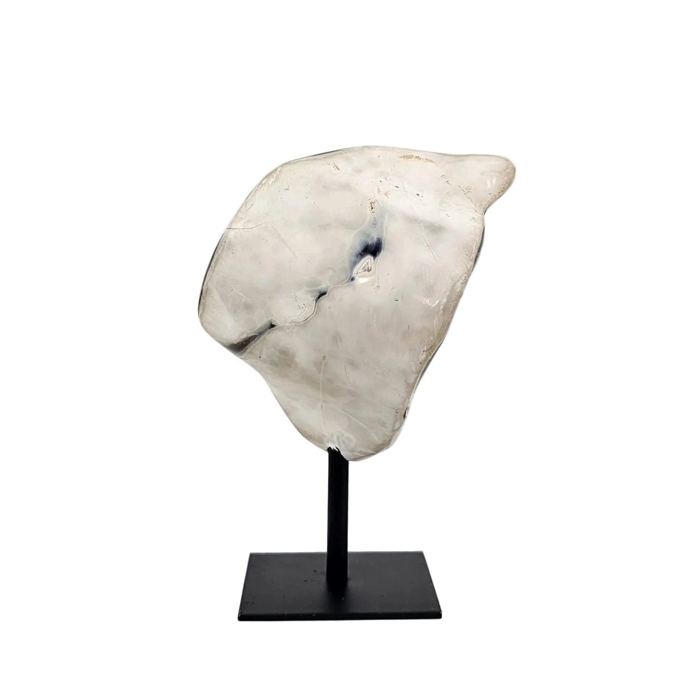 Back view orca agate on a stand with a white background