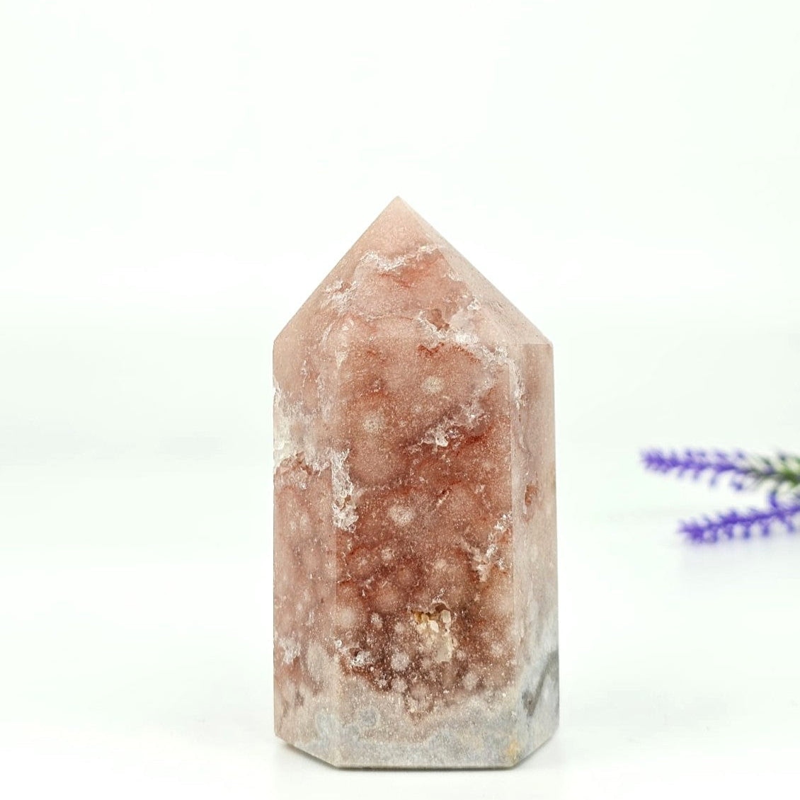 Pink amethyst high quality tower from brazil on a white background