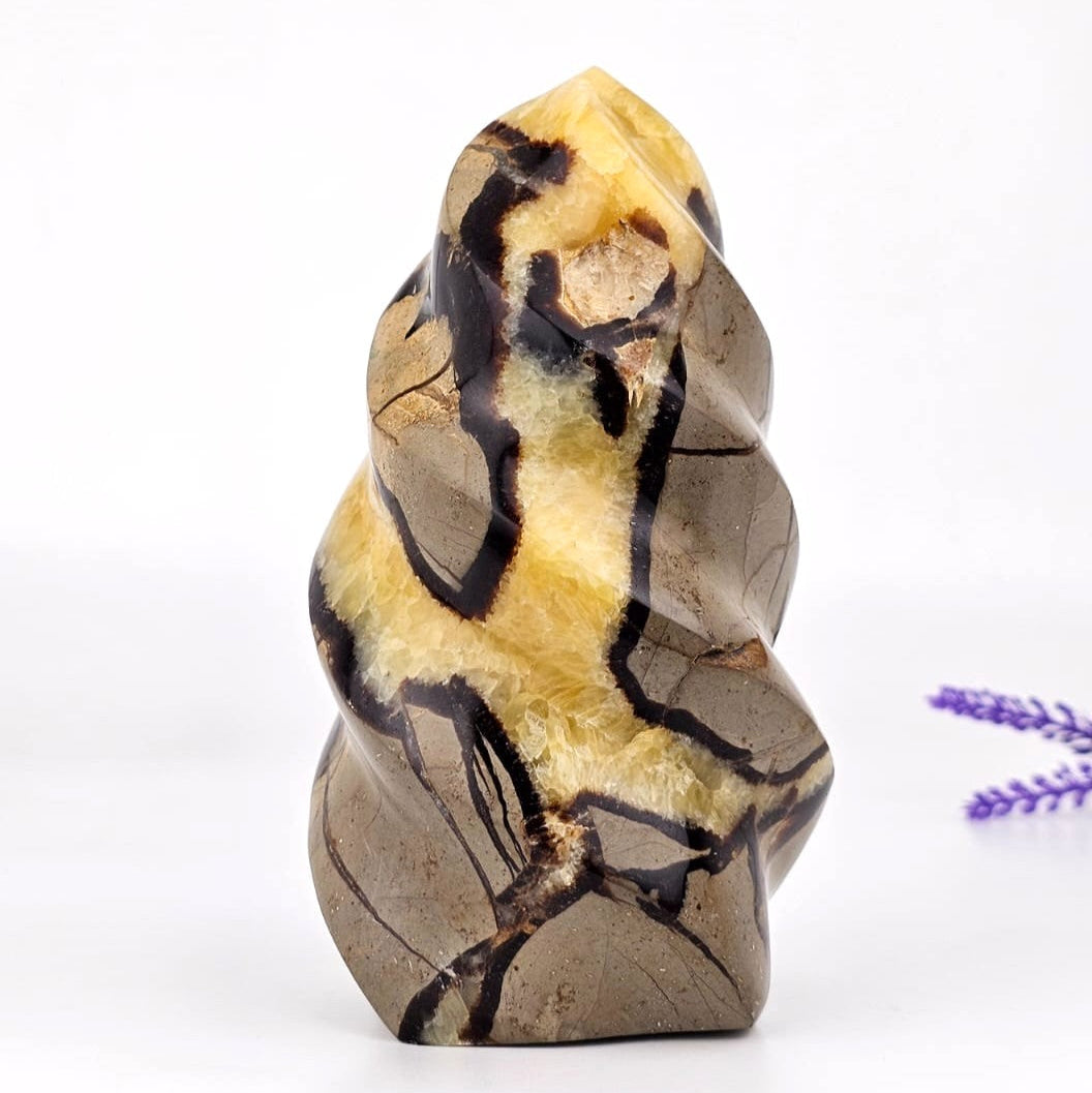 Septarian flame sculpture on a white background