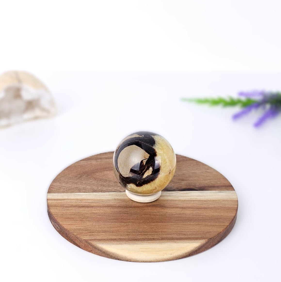 septarian-sphere-on-wooden-board