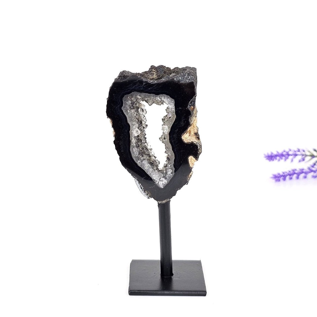black agate druzy portal on a stand and a white background