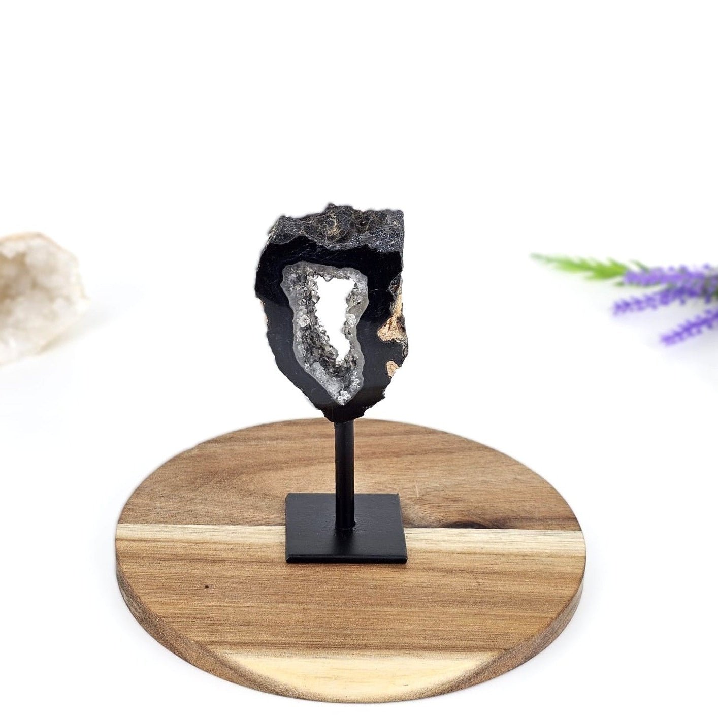 black agate opal on stand and a wooden plate