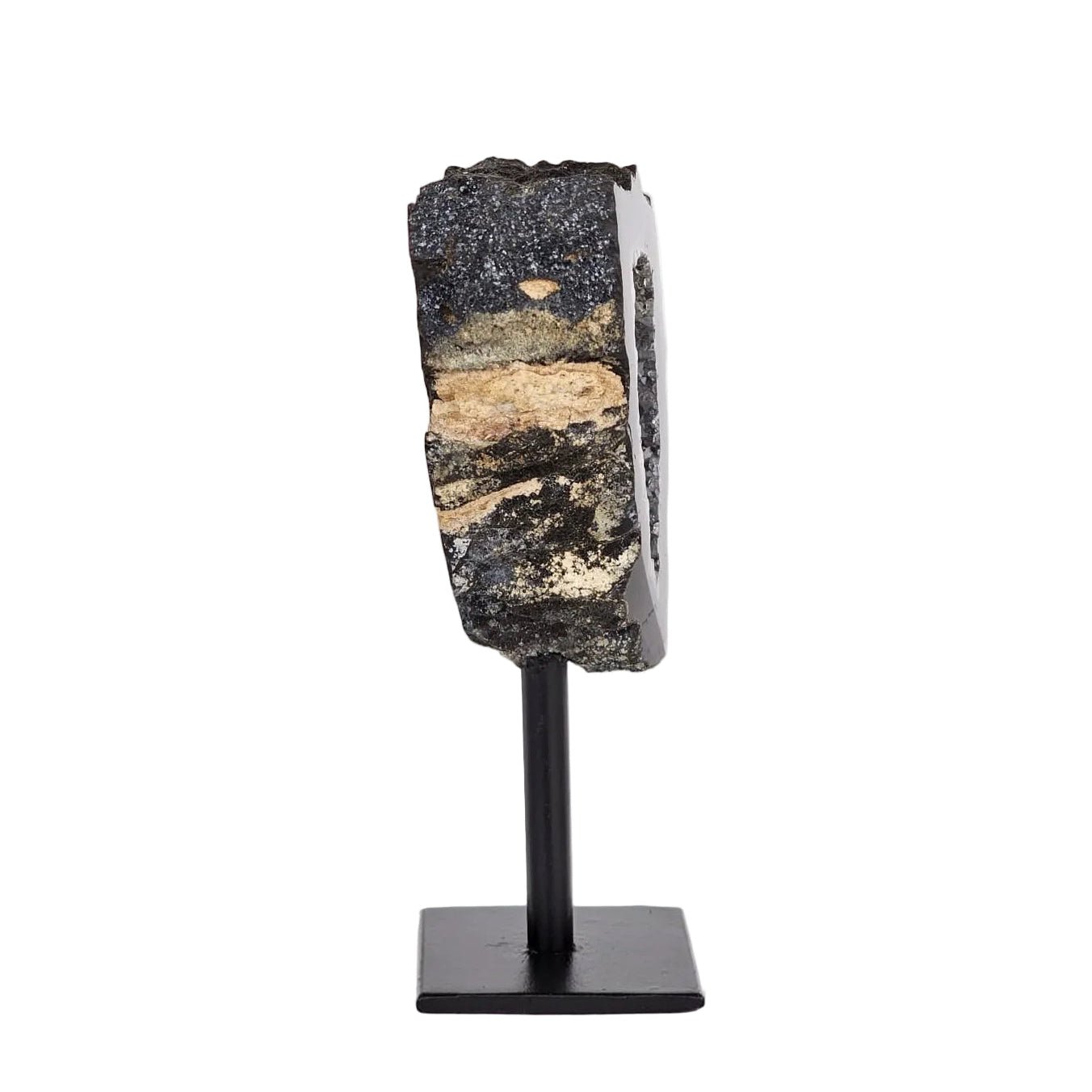 black agate side view on stand and a white background