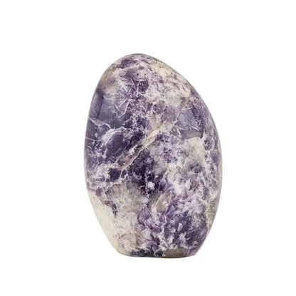 Lepidolite stone on a white background