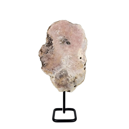 pink amethyst slab on a stand with a white background