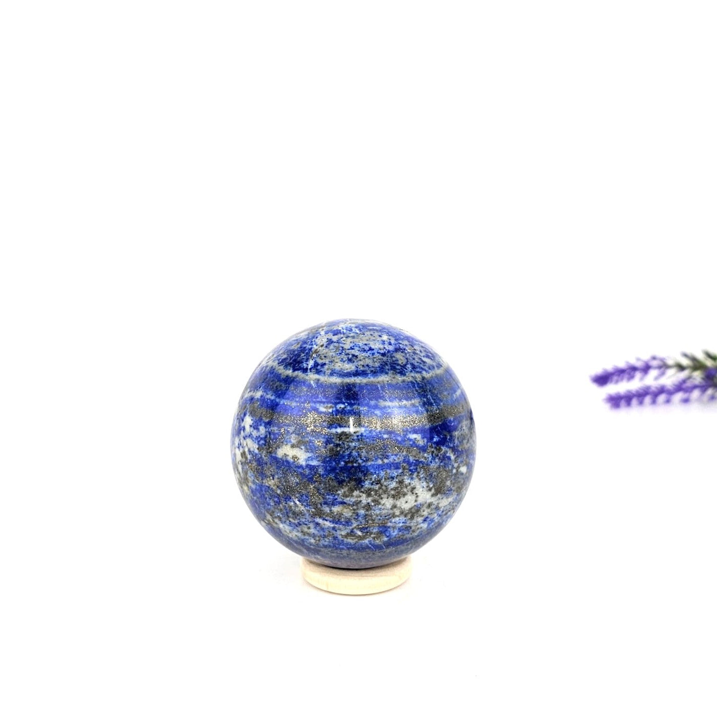 lapis lazuli crystal sphere on a white background
