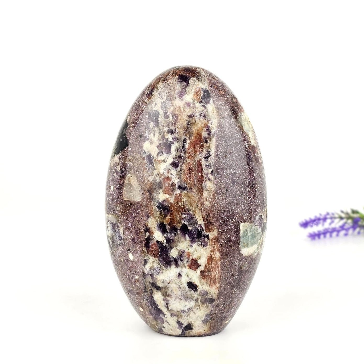 lepidolite in permatite freeform on a white background