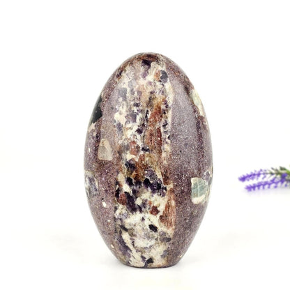 lepidolite in permatite freeform on a white background