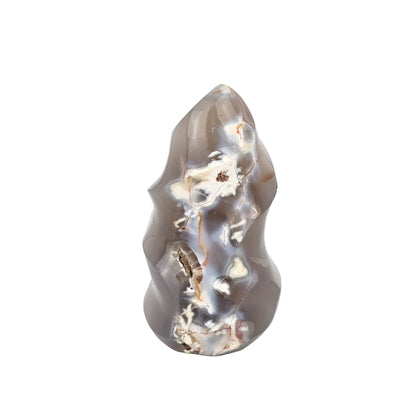 Orca agate flame sculpture on a white background