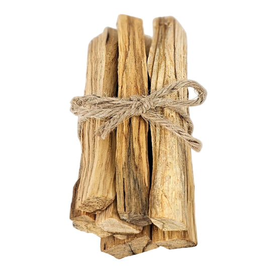 Bundled sustainable Palo Santo sticks tied with twine on white background