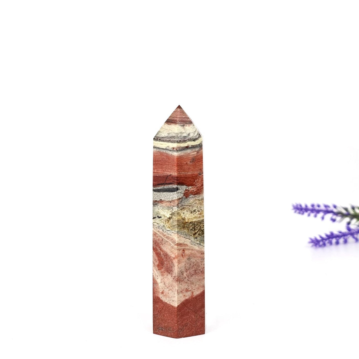 Red jasper tower with a white background
