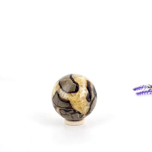 septarian crystal sphere on a white background
