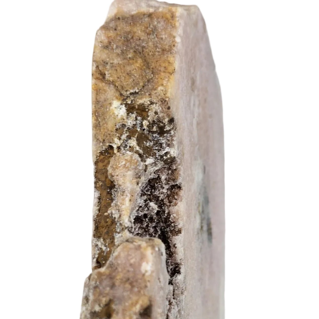 Close-up of a pink amethyst side view on a white background